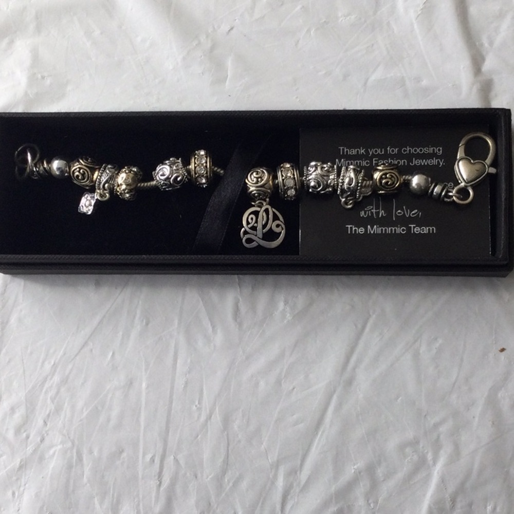 Charm Bracelet with 10 charms one charm with the initial L.   NWOT